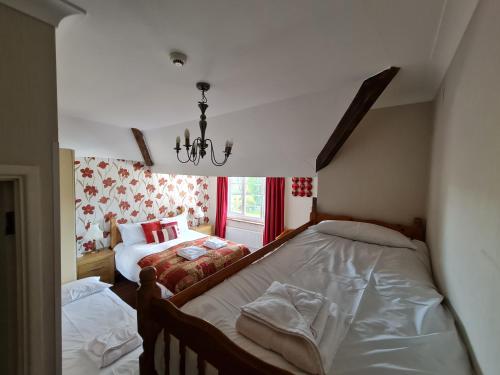 Ένα ή περισσότερα κρεβάτια σε δωμάτιο στο OYO Lavender House Hotel