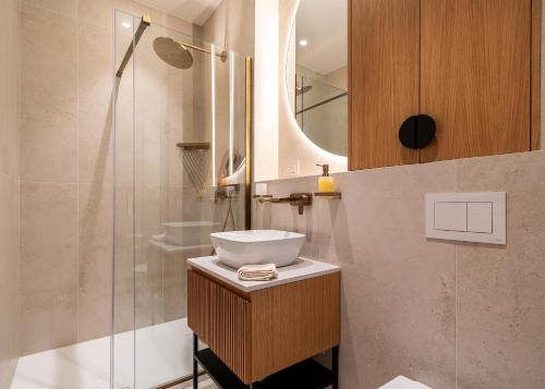 a bathroom with a sink and a shower at Villa Ladeti Sereno in Poljane