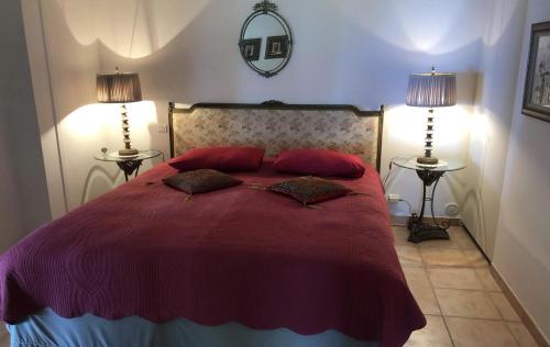 a bedroom with a large bed with two lamps at Majestic Monaco Villa in La Turbie