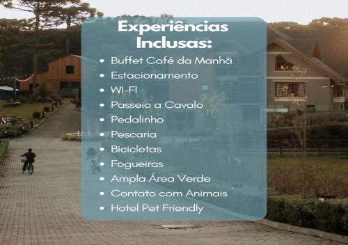 a sign that is on the side of a sidewalk at WoodStone Hotel Fazenda in Gramado