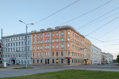 a large brick building on the corner of a street at Eurostars Metropole in Rīga