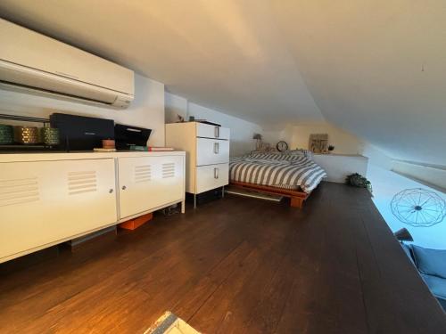 a bedroom with a bed in a attic at Cosy Rooftop Studio Nice Centre in Nice