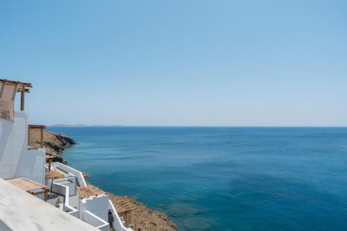 a view of the ocean from the side of a building at Caldera Studios in Astypalaia Town