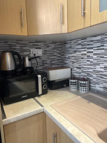 Η κουζίνα ή μικρή κουζίνα στο Violeta Apartments