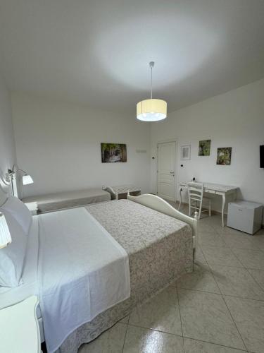 Ένα ή περισσότερα κρεβάτια σε δωμάτιο στο B&B White Rooms Salento