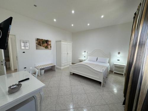 Ένα ή περισσότερα κρεβάτια σε δωμάτιο στο B&B White Rooms Salento