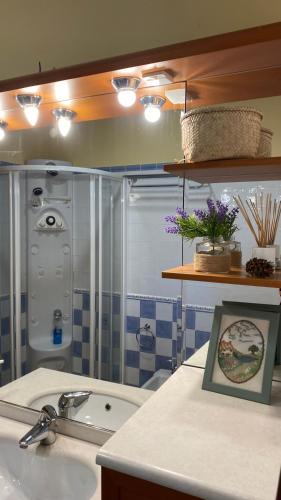a bathroom with a sink and a bath tub at Mandarina Room with incredible view in Alzira