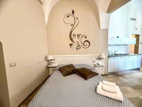 Postel nebo postele na pokoji v ubytování Finya Apartments - Affitti Brevi Italia
