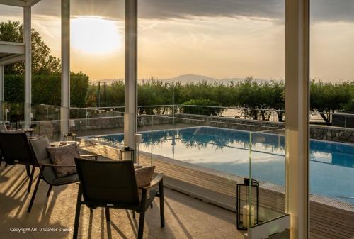a view of a swimming pool from a house at Hotel Vila Rova in Malinska