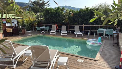 a swimming pool with chairs and a toy in the water at Eterea Charming Suites in Sorrento