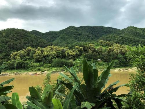 a view of a river with mountains in the background at 2 days Mekong cruise package with Mekong Lover Cruise from Houay Xay to Luang Prabang or Mekong cruise from Luang Prabang to Huay Xai - Thailand in Ban Khonkèo