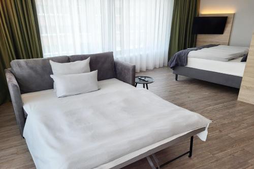 Un ou plusieurs lits dans un hébergement de l'établissement Holiday Inn - the niu, Crusoe Bremen Airport by IHG