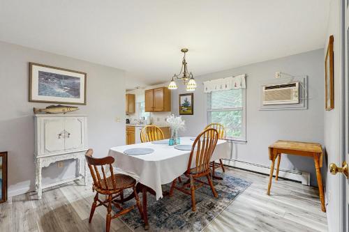 a kitchen and dining room with a table and chairs at The Drift-in in Port Clyde