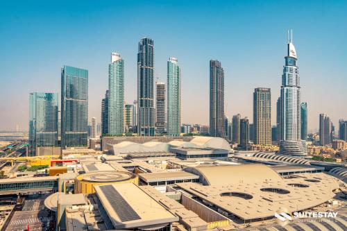 a view of a city skyline with tall buildings at Fashion avenue Dubai Mall -The Residence in Dubai