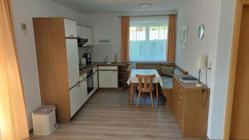 a kitchen with a table and a dining room at Haus Monika in Obsteig