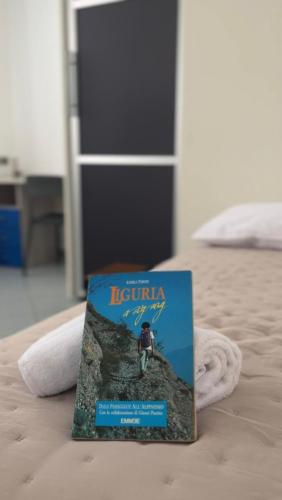 a book sitting on top of a bed at Isa's house in Savona