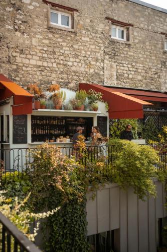 a restaurant with people sitting at a table at Grands Boulevards Experimental in Paris