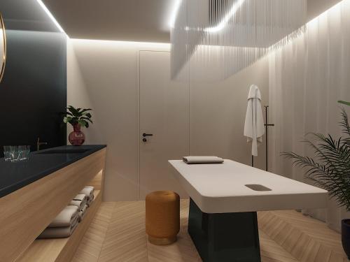 a bathroom with a white counter and a sink at INFINITY Budapest Hotel in Budapest