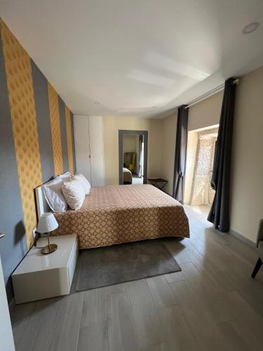 a bedroom with a bed and a table in it at Cantinho Sto Amaro in Arcos de Valdevez