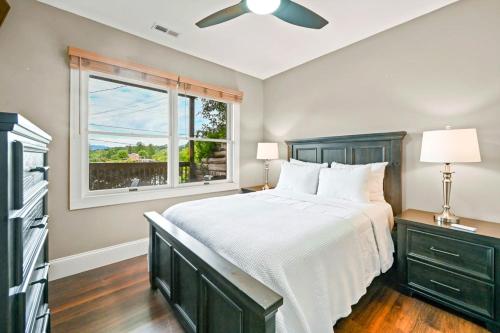 a bedroom with a large bed and a window at Lakeshore Living in Lake Junaluska