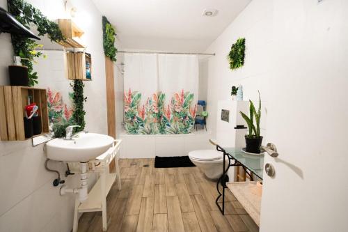 a bathroom with a sink and a toilet at Casa brisa in Tel Aviv