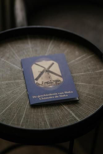 a blue book sitting on top of a table at Marie Siska Boutique hotel in Knokke-Heist