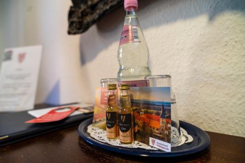 a bottle of alcohol sitting on a table at Klosterhotel Wöltingerode in Goslar