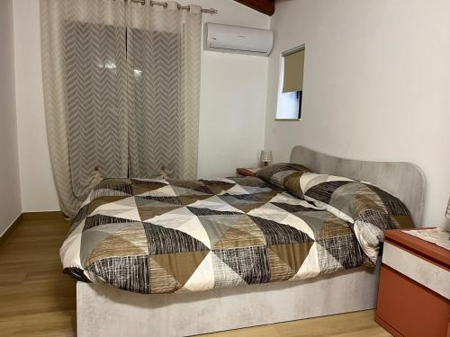 a bedroom with a large bed and a window at Ricchizza di casa in Naro