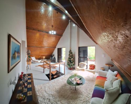 a living room with a couch and a table at Demetrio House in Santo Antônio do Pinhal