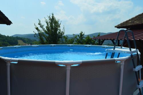 a large plunge pool on the side of a house at Kuća Luna in Gornji Milanovac