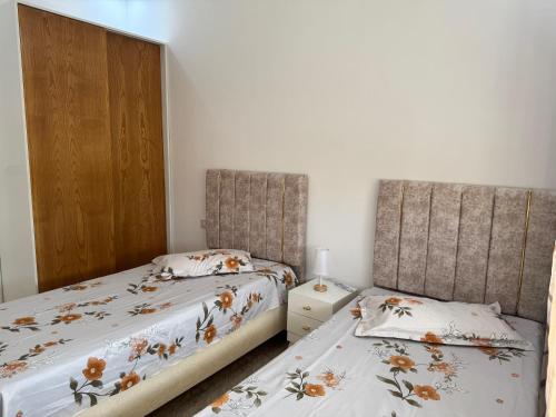 Postel nebo postele na pokoji v ubytování Ibrahim apartment