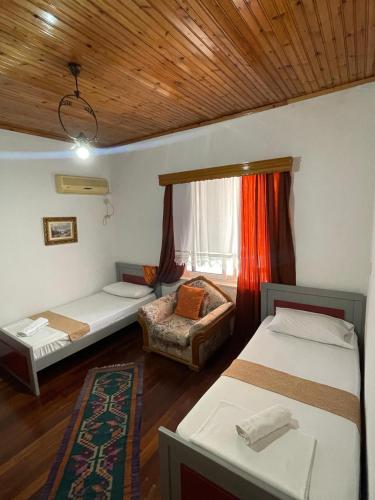 Llit o llits en una habitació de Guesthouse Bazzar