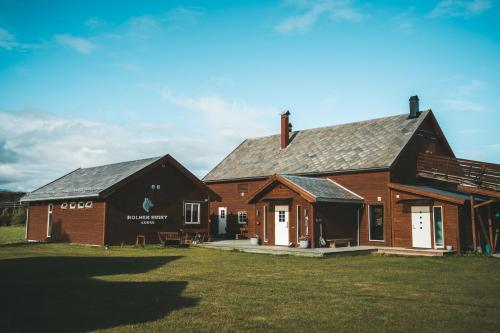 a large house with a barn at Holmen Husky Lodge in Alta
