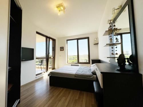 a bedroom with a bed and a large mirror at Villa Mare Apartment in St. St. Constantine and Helena