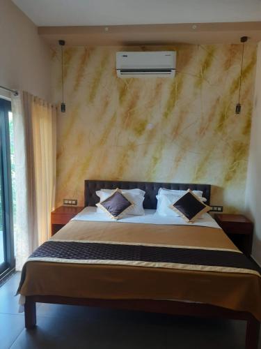 Katil atau katil-katil dalam bilik di Vipinam, The riverside retreat