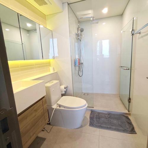 a bathroom with a white toilet and a shower at BTS onnut loft quiet room Netflix Rooftop bar in Bangkok