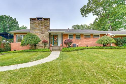 a brick house with a grass yard at 3 Mi to Pro Football Hall of Fame Home with Yard! in Canton