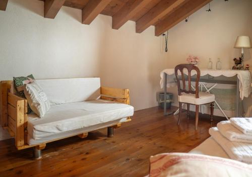 a living room with a couch and a chair at B&B Il Posto delle Rose in Almenno San Salvatore