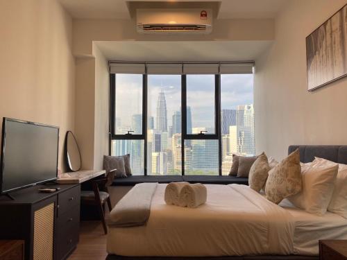 Ένα ή περισσότερα κρεβάτια σε δωμάτιο στο Ceylonz Suites By Staybliss