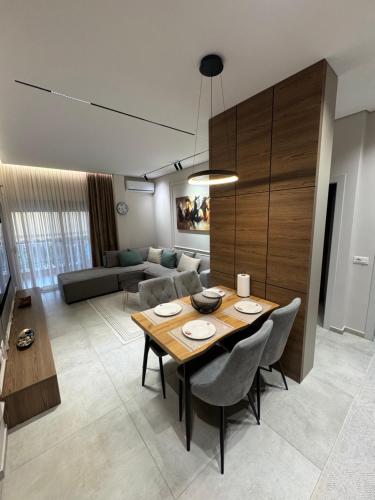 a living room with a table and a couch at Ambla holidays in Golem