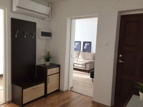 a living room with a door leading into a living room at Holiday apartment Helena in Kõrgessaare