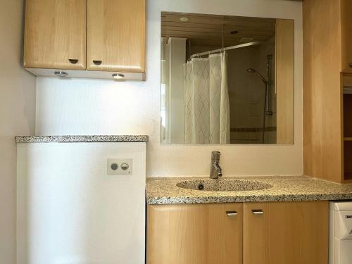 a kitchen with a white refrigerator and a sink at Spacious Apartment for 4 in Aalborg