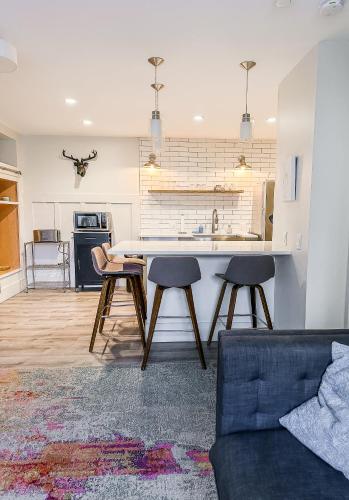 a kitchen and living room with a table and chairs at The 4M Golden House - Central Location Beautiful Space & Neighborhood in Ann Arbor