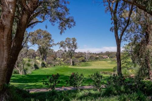 a view of a golf course with trees at 9-3 Glenelg Place Connolly A9 Elegant 3 bed apt in the heart of Connolly in Perth