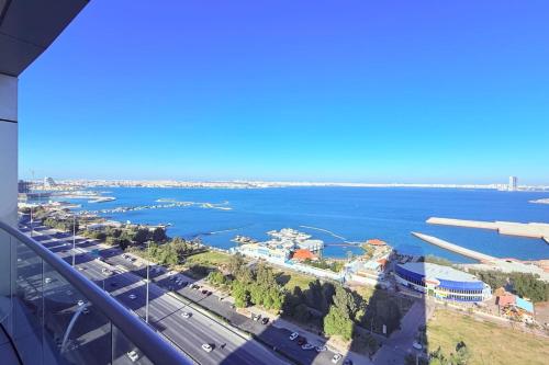 a view of the water from a building at Blue Seaview 75 inch Smart TV 1Br in Manama