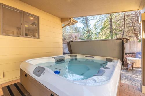 a jacuzzi tub in the corner of a house at Spacious 3BR Yavapai Retreat with Nature Views, Hot Tub and Game Room in Sedona