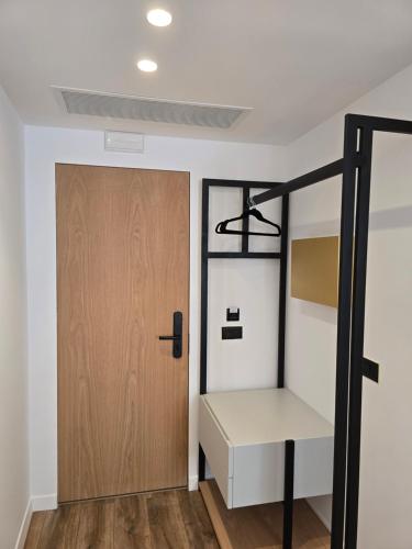 a room with a bunk bed and a door at Palorto Inn in Gjirokastër