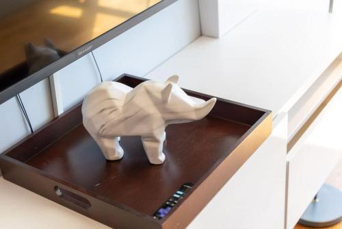 a statue of a rhino sitting on top of a laptop at Ent District 3 Bedroom 2Bath Parking CN Tower in Toronto