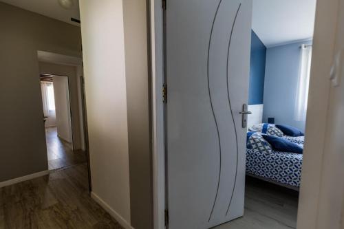 a room with a bedroom with a bed and a mirror at Gite salis in Toulouzette