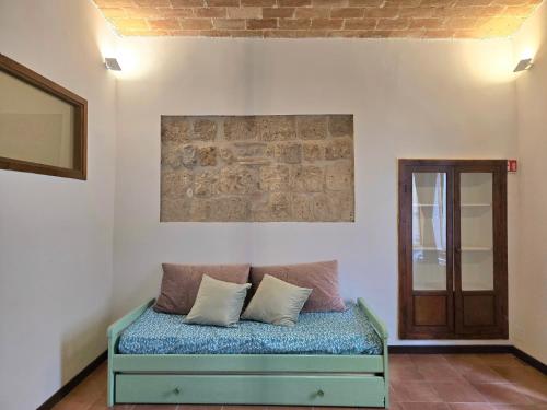 En eller flere senge i et værelse på Casetta al Corso